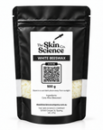 White Beeswax 500 g — black windowed SSC pouch with pale ivory pellets, vertical white label across window.