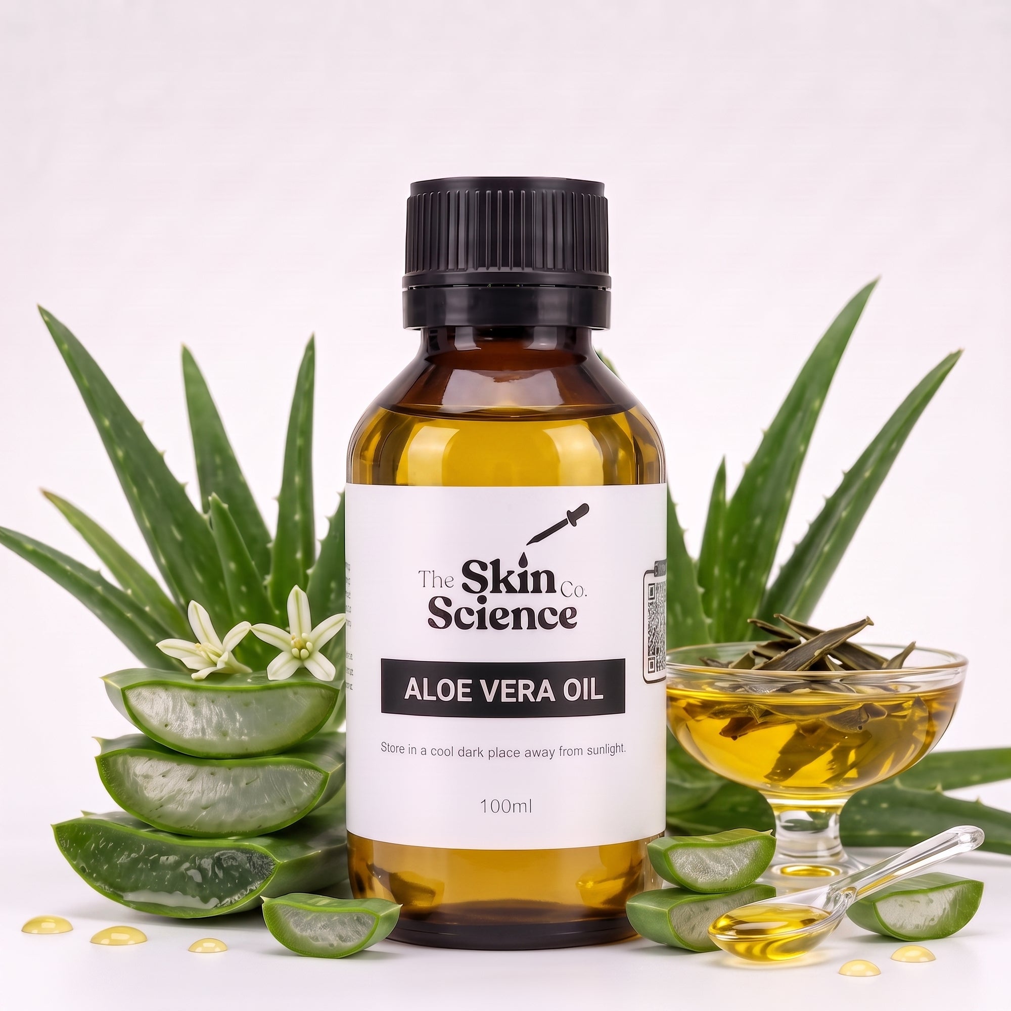 A 100ml bottle of Aloe Vera Oil by The Skin Co. Science, presented in an amber glass bottle with a black cap and a white label.